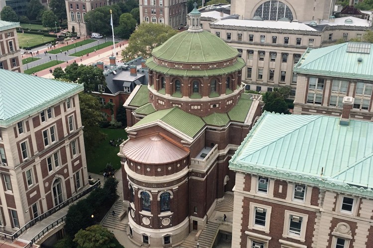 An aerial view of St. Paul's Chapel with a new terra cotta roof tiles installed as well as an apse copper roof on the eastern portion of the building.