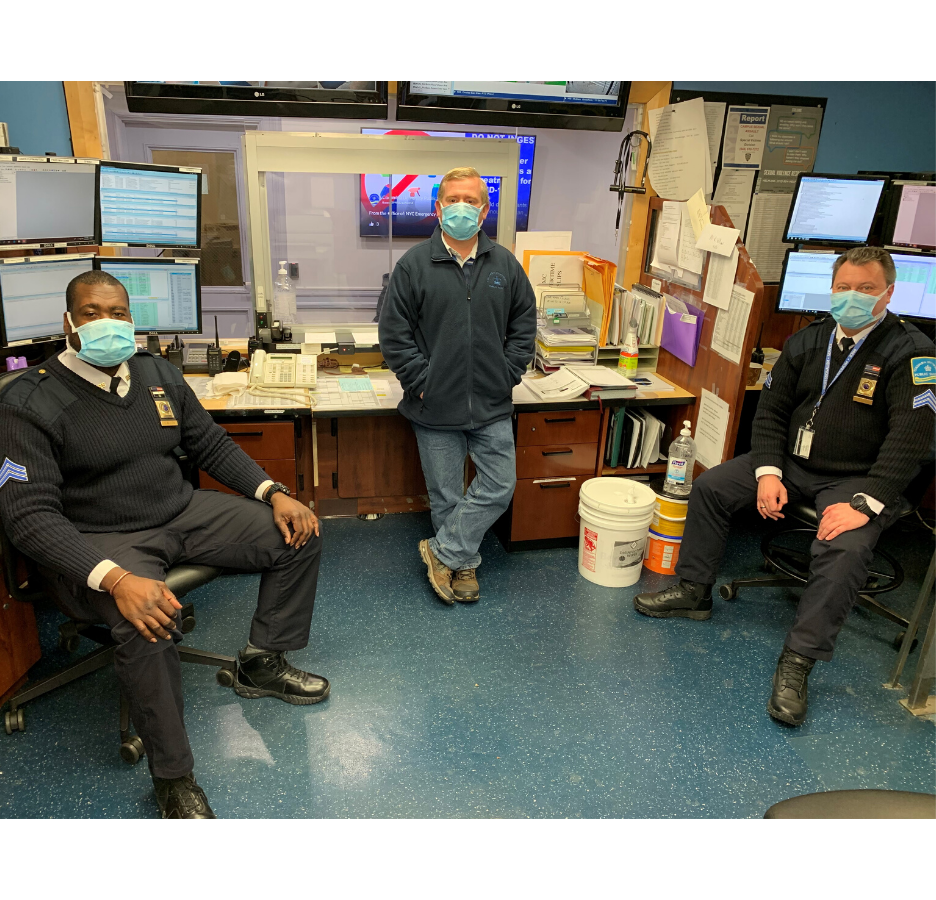 The Morningside campus Public Safety team members sit in an office with masks on 
