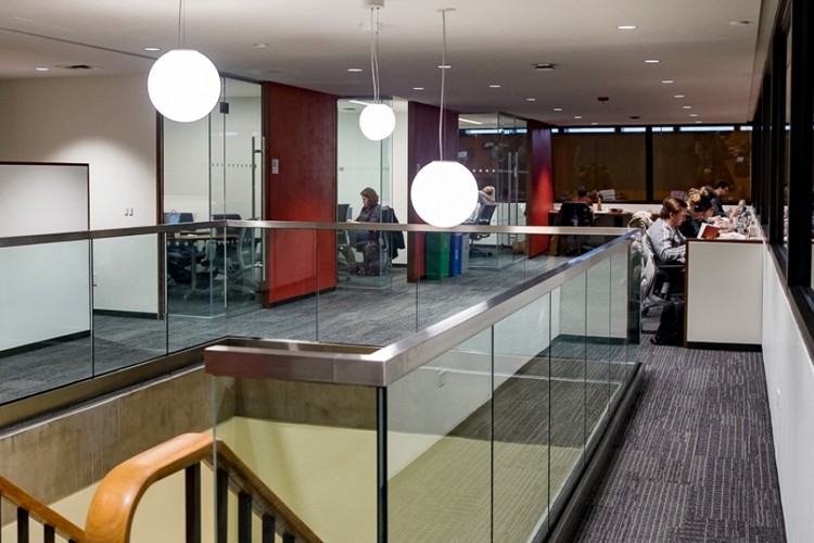 Students writing at desks at the GSAS Writing Studio in the Lehman Library